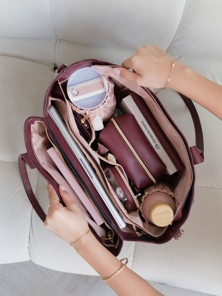 Overhead view of the Poppy & Peonies Double Duty Tote in Berry packed with everyday essentials and organized interior compartments.