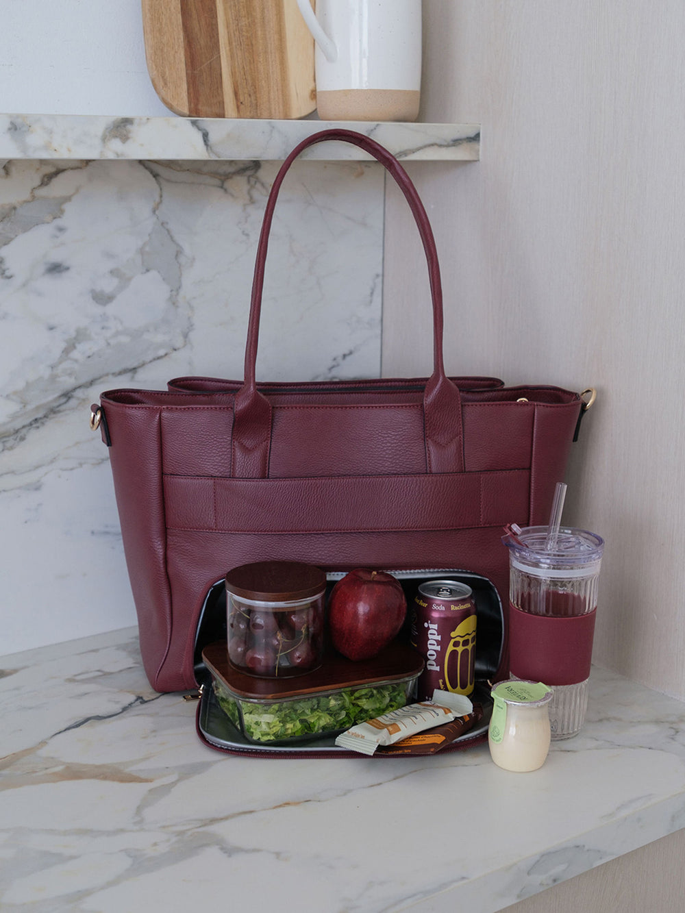 Poppy & Peonies Double Duty Tote in Berry styled with lunch, snacks and iced coffee, showcasing everyday carry capacity.