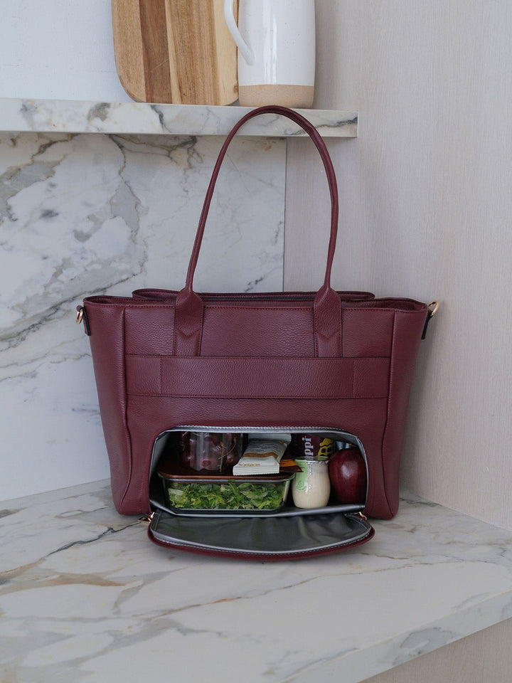 Poppy & Peonies Double Duty Tote in Berry showcasing the insulated lunch compartment with lunch and snacks.
