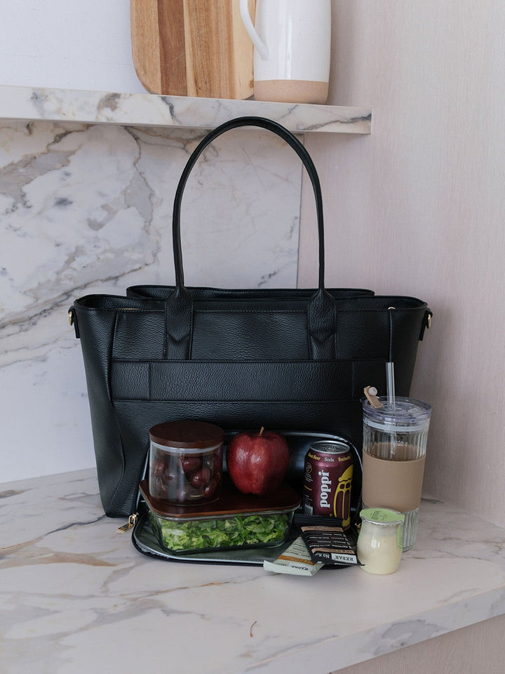 Poppy & Peonies Double Duty Tote in Black styled with lunch, snacks and iced coffee, showcasing everyday carry capacity.