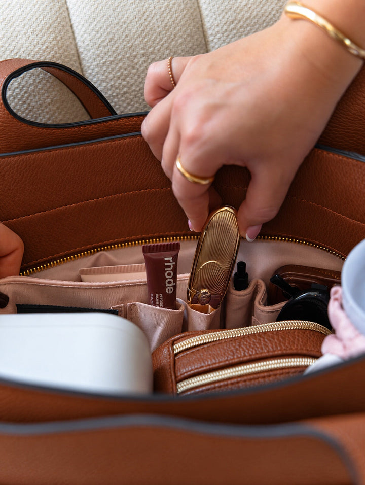 Poppy & Peonies The Companion Tote in Chestnut interior close-up, showcasing organizational slide pockets for lipstick, beauty products and everyday essentials.