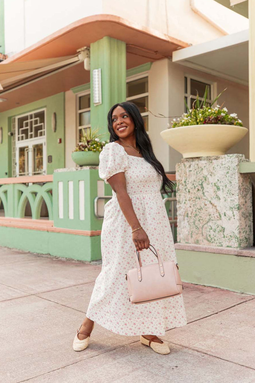 Woman holding Poppy & Peonies blush coloured Out and About Bag
