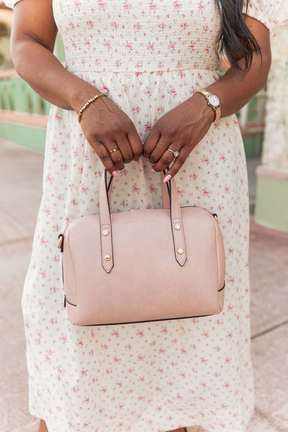 Woman holding Poppy & Peonies blush coloured Out and About Bag