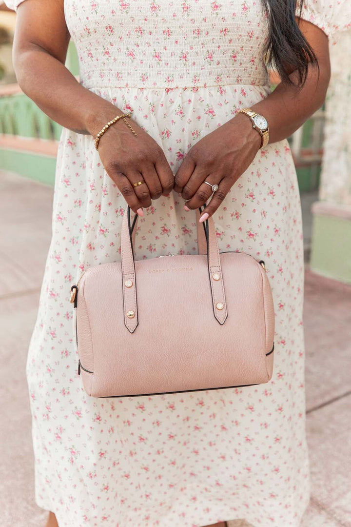 Woman holding Poppy & Peonies blush coloured Out and About Bag
