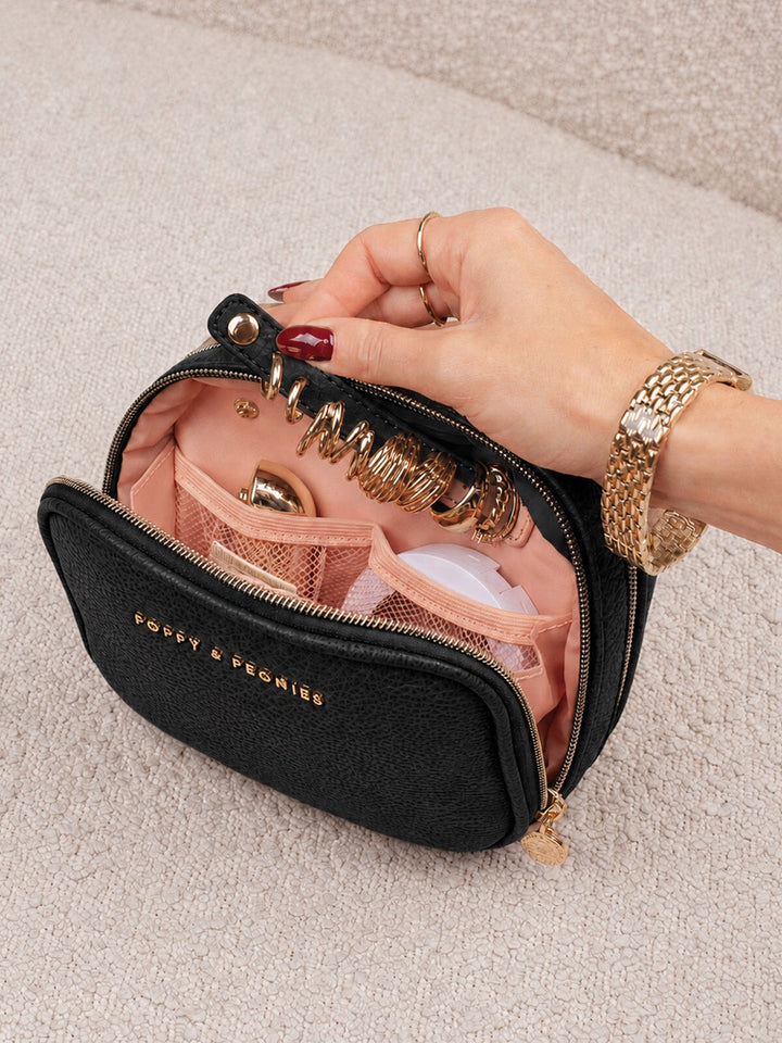 Poppy & Peonies Pretty Connected Case in Black interior close-up, showcasing the blush-pink lining, key clip and organizational pockets.